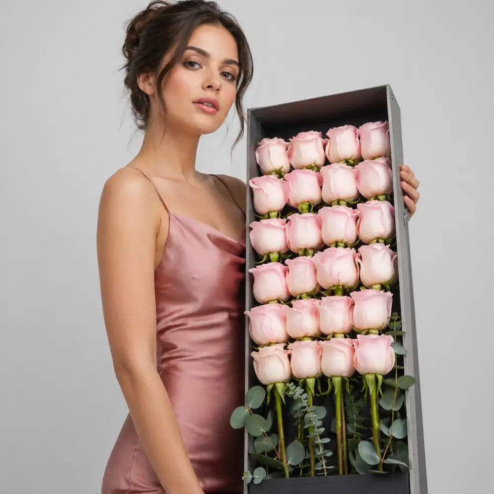 Box of Blush roses with 'Forever Bloom' branding on a gray background