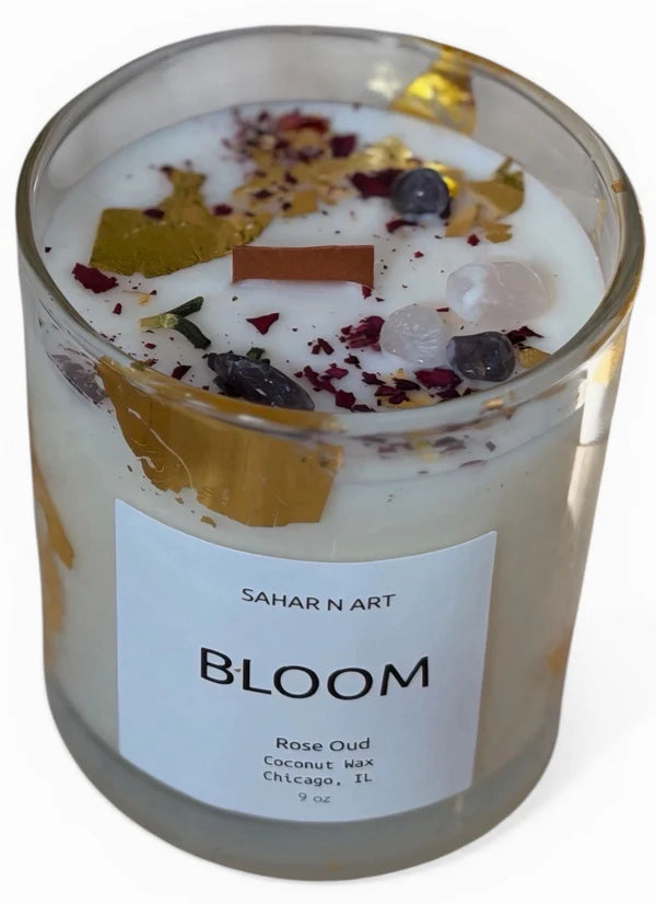 Scented candle labeled 'Bloom' by Sahar N Art with decorative elements on a white background