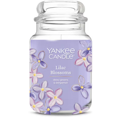 Yankee Candle Lilac Blossoms candle jar with floral design on a white background