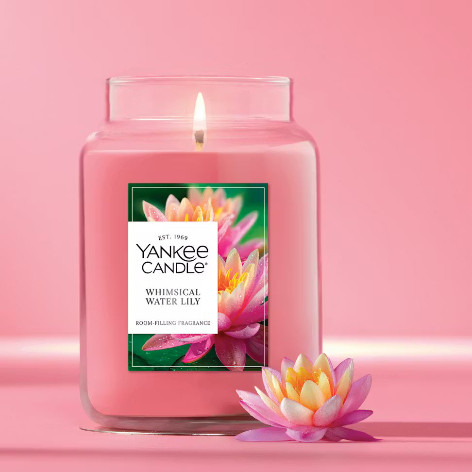 Yankee Candle Whimsical Water Lily candle on a pink background