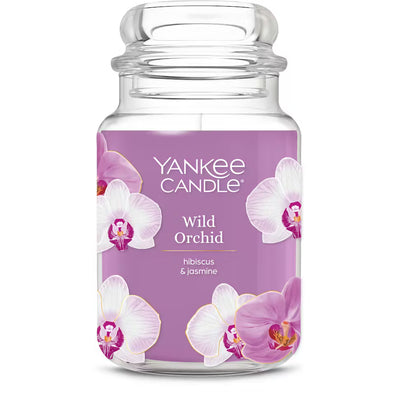 Yankee Candle Wild Orchid candle jar with a purple label and orchid graphics on a white background